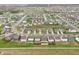 Aerial view of a suburban neighborhood with rows of houses and green spaces at 5150 Bramwell Ln, Whitestown, IN 46075