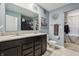 Bathroom showcasing a double sink vanity, decorative mirrors, and elegant decor at 5150 Bramwell Ln, Whitestown, IN 46075