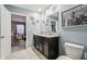 Bathroom featuring a double vanity, granite countertop, and neutral paint at 5150 Bramwell Ln, Whitestown, IN 46075