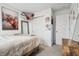 Cozy bedroom featuring a comfortable bed, soft carpet, and ample storage with a closet and decorations at 5150 Bramwell Ln, Whitestown, IN 46075