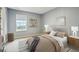 This bedroom features a calming color palette, carpet flooring, natural light, and decor shelves at 5150 Bramwell Ln, Whitestown, IN 46075