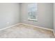 Neutral bedroom features a window with blinds and light-colored carpet at 5150 Bramwell Ln, Whitestown, IN 46075