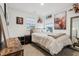 Charming bedroom features a cozy bed, rustic decor, and ample natural light through two windows at 5150 Bramwell Ln, Whitestown, IN 46075