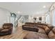 Cozy living room with modern decor, featuring a plush brown sectional sofa and plenty of space at 5150 Bramwell Ln, Whitestown, IN 46075
