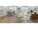 Bright living room featuring stylish furniture, wooden floors, and large windows for ample natural light at 5150 Bramwell Ln, Whitestown, IN 46075