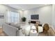 Comfortable living room with modern decor, featuring a plush sofa, accent chair, and a sleek entertainment center at 5150 Bramwell Ln, Whitestown, IN 46075