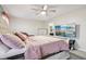 Well-appointed main bedroom showcasing a plush bed, ceiling fan, and a mounted television at 5150 Bramwell Ln, Whitestown, IN 46075