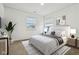Bright main bedroom featuring a cozy bed, natural light, and minimalist decor for a relaxing ambiance at 5150 Bramwell Ln, Whitestown, IN 46075