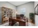 Inviting office with wood desk, shelving, and a cozy rug, perfect for a productive work environment at 5150 Bramwell Ln, Whitestown, IN 46075