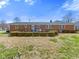 Backyard view showing the back of a brick home at 5240 Magnolia Dr, Columbus, IN 47203