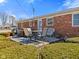 Charming brick home featuring a backyard deck perfect for outdoor dining and relaxation at 5240 Magnolia Dr, Columbus, IN 47203