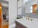 Bathroom with gray walls, marble countertop, and view to bedroom at 5240 Magnolia Dr, Columbus, IN 47203