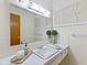Bathroom features a large mirror, ample counter space, and white cabinets at 5240 Magnolia Dr, Columbus, IN 47203