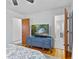Bedroom features wood floors and a mounted television at 5240 Magnolia Dr, Columbus, IN 47203