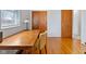 Bedroom features wood floors, a desk by the window and closet storage at 5240 Magnolia Dr, Columbus, IN 47203