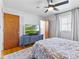 Bedroom features wood floors and a mounted television at 5240 Magnolia Dr, Columbus, IN 47203