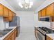 Functional kitchen featuring stainless steel appliances, gas range, and ample counter space at 5240 Magnolia Dr, Columbus, IN 47203