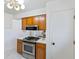 Stainless steel oven and microwave complement the wooden cabinetry in this well-lit kitchen at 5240 Magnolia Dr, Columbus, IN 47203