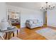Comfortable seating in living room with decorative rug and hardwood flooring at 5240 Magnolia Dr, Columbus, IN 47203