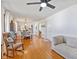 Inviting living room with hardwood floors, modern ceiling fan and comfortable rocking chair at 5240 Magnolia Dr, Columbus, IN 47203