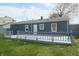 Backyard view with gray deck and partially fenced yard at 5314 W 34Th St, Indianapolis, IN 46224