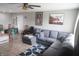 Cozy living room featuring a large gray sectional sofa and tile floors at 5314 W 34Th St, Indianapolis, IN 46224