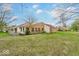 A spacious backyard view with lush green grass at 5453 Happy Hollow # 73, Indianapolis, IN 46268
