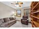Bedroom with light walls, ceiling fan, built-in shelves, carpet and two windows at 5453 Happy Hollow # 73, Indianapolis, IN 46268