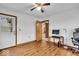 This bedroom has hardwood floors and a white door to the back at 5453 Happy Hollow # 73, Indianapolis, IN 46268