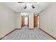 Spacious bedroom with neutral walls, carpeted floor, and multiple closets and doorways at 5453 Happy Hollow # 73, Indianapolis, IN 46268