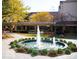 Beautiful water fountain surrounded by landscaping creating an inviting ambiance for outdoor relaxation at 5453 Happy Hollow # 73, Indianapolis, IN 46268