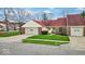 Pleasant single-story home with an attached garage and verdant front lawn at 5453 Happy Hollow # 73, Indianapolis, IN 46268