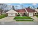 Inviting single-story home with attached garage and well-maintained lawn at 5453 Happy Hollow # 73, Indianapolis, IN 46268
