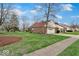 Charming brick home with a well-maintained front yard at 5453 Happy Hollow # 73, Indianapolis, IN 46268