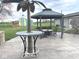 Outdoor gathering area featuring gazebos, metal palm tree and a concrete patio at , Indianapolis, IN 46203