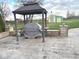View of the backyard featuring a gazebo with grill, shed, and spacious yard at , Indianapolis, IN 46203