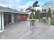 Concrete patio featuring metal palm tree, gazebo with grill, and brick house at , Indianapolis, IN 46203