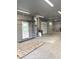 Bright garage space with utilities, featuring a convenient door leading to the exterior of the home at , Indianapolis, IN 46203
