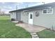 Detached garage and outdoor space with green siding and fresh landscaping at , Indianapolis, IN 46203