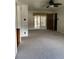Bright living room featuring neutral carpet, ceiling fan and access to an enclosed patio space at , Indianapolis, IN 46203