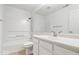 Clean bathroom with a bathtub, toilet, and vanity with sink and a large mirror at 5842 Minden Dr, Indianapolis, IN 46221