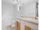 Clean bathroom featuring double sinks and a built-in bathtub at 5842 Minden Dr, Indianapolis, IN 46221