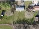 An aerial view showcases this property, surrounded by expansive green spaces and neighboring homes at 589 S 100 W, Franklin, IN 46131