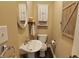 Bright powder room with weathered cabinet, rustic decor, and a decorative mirror at 589 S 100 W, Franklin, IN 46131