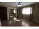 Light filled bedroom with hardwood floors, large window, and mirrored closet at 589 S 100 W, Franklin, IN 46131