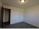 Clean bedroom with carpet and closet with white sliding doors at 589 S 100 W, Franklin, IN 46131