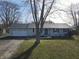 Charming one-story home featuring a two-car garage, well-kept lawn, and neutral colored siding at 589 S 100 W, Franklin, IN 46131