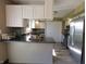 Well-lit kitchen featuring white cabinets, stainless steel appliances, and stylish countertops at 589 S 100 W, Franklin, IN 46131