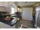 Stylish kitchen featuring gray countertops, stainless steel appliances, and white cabinets at 589 S 100 W, Franklin, IN 46131