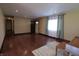 Bright living room featuring hardwood floors and a light-filled window at 589 S 100 W, Franklin, IN 46131